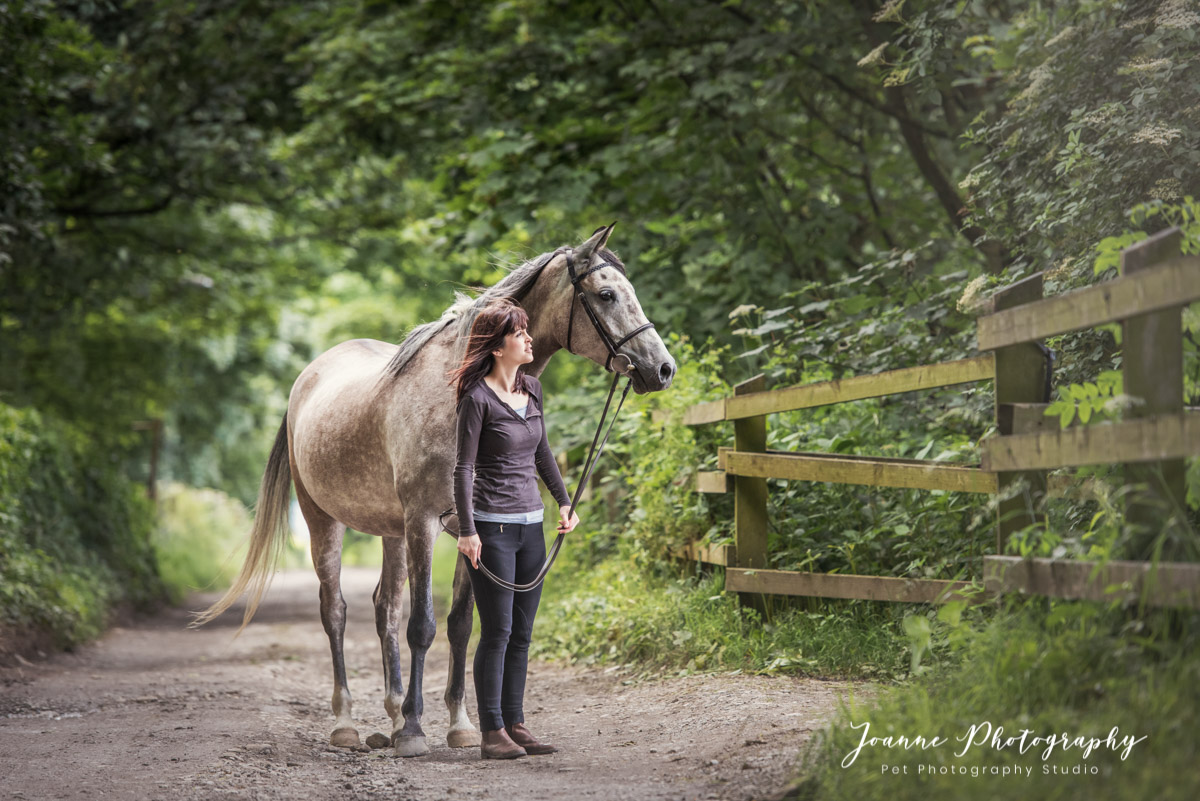 Holly and her beautiful horse having a country walk.